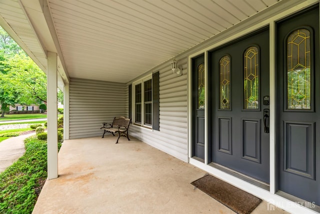 19 Redcoat Dr, East Brunswick, NJ 08816 - view of exterior entry with a porch