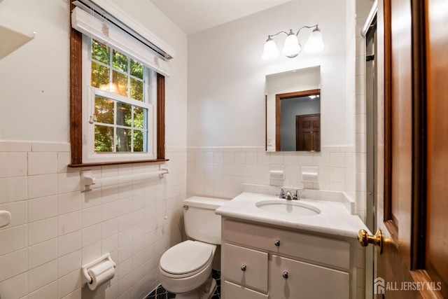19 Redcoat Dr, East Brunswick, NJ 08816 - bathroom featuring tile walls, vanity, and wainscoting