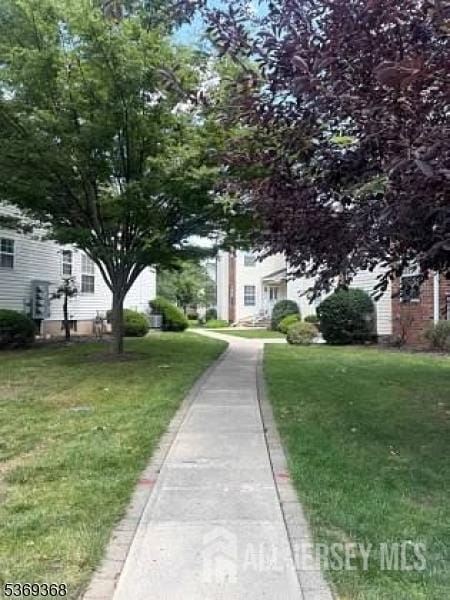 416-416 Ripley Ct, Piscataway, NJ 08854 - view of property hidden behind natural elements featuring a front lawn