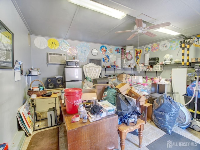 interior space featuring a wall mounted air conditioner and ceiling fan