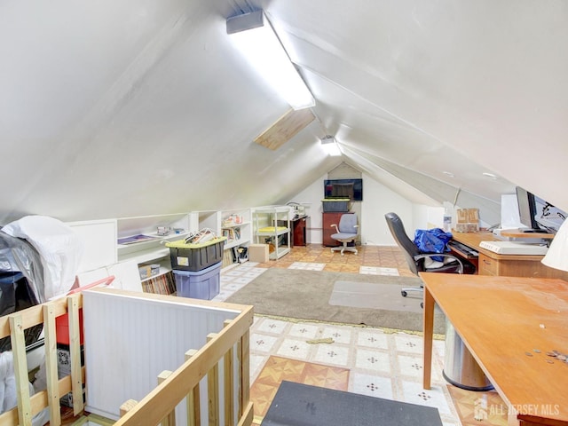 office space with tile patterned floors and lofted ceiling