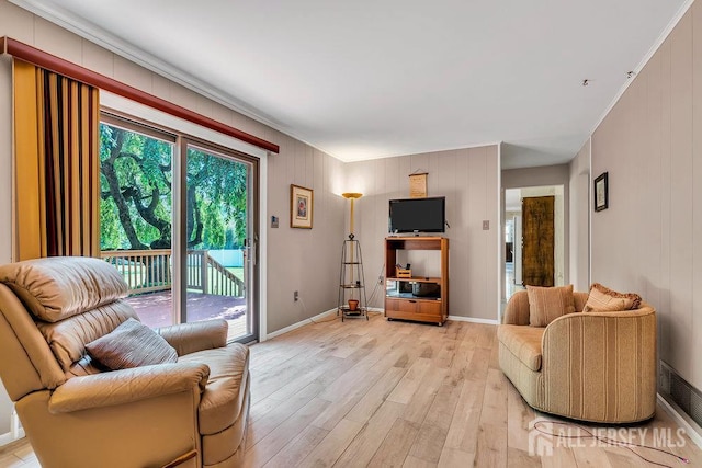 27 Appleby Ln, East Brunswick, NJ 08816 - living room featuring light wood-style floors and crown molding