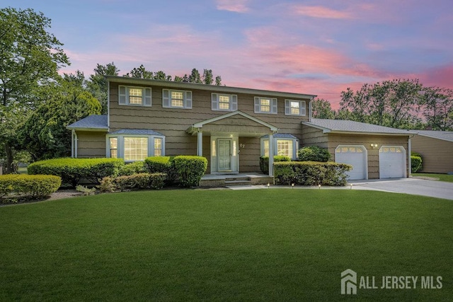 27 Appleby Ln, East Brunswick, NJ 08816 - colonial inspired home featuring a front yard, driveway, and an attached garage