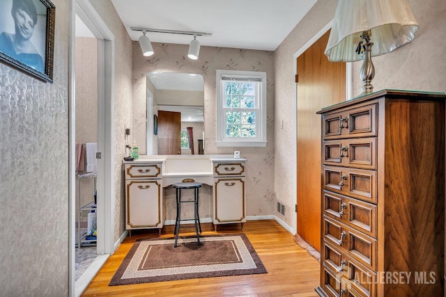 27 Appleby Ln, East Brunswick, NJ 08816 - bathroom with rail lighting, wood finished floors, vanity, and a textured wall
