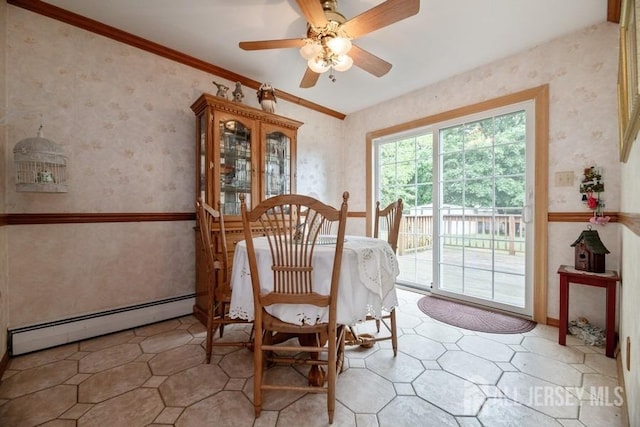 dining area featuring a baseboard radiator, wallpapered walls, a ceiling fan, and crown molding