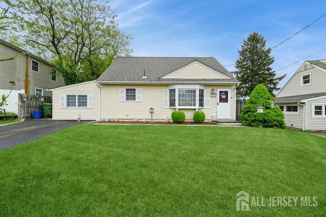 53 Cedar Ter, Sayreville, NJ 08859 - view of front of house with a front yard and a shingled roof