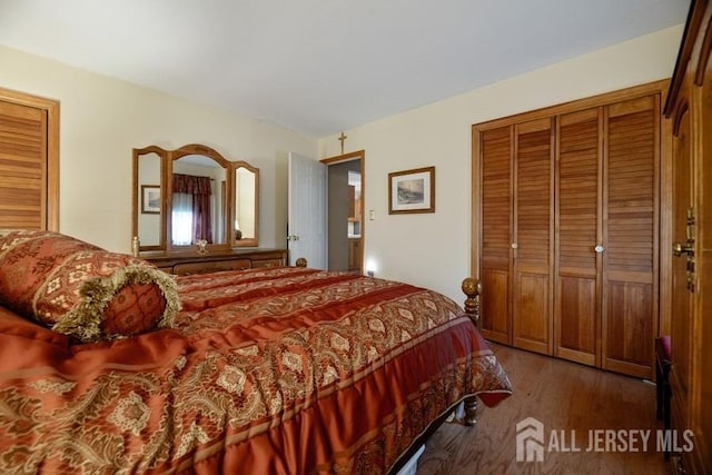 bedroom with a closet and wood finished floors
