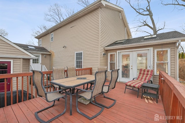 deck featuring french doors and outdoor dining area