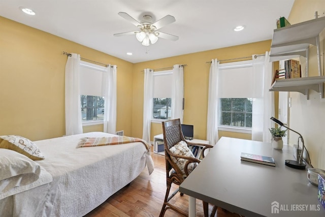 bedroom featuring recessed lighting, a ceiling fan, and wood finished floors