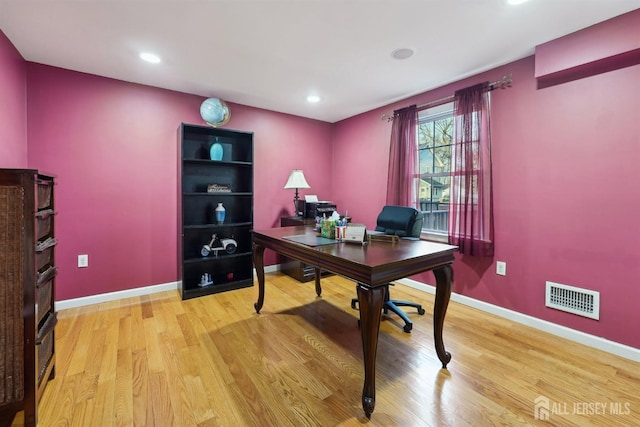 office space with recessed lighting, wood finished floors, visible vents, and baseboards