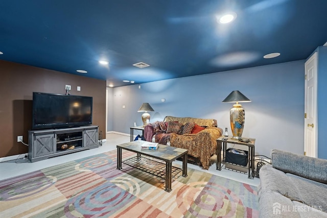 carpeted living room with recessed lighting and visible vents