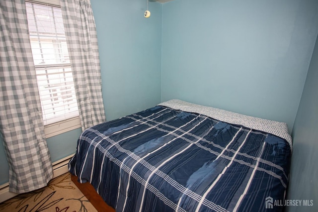 bedroom featuring a baseboard radiator