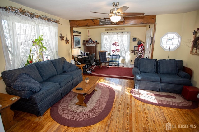 living room featuring hardwood / wood-style flooring and ceiling fan