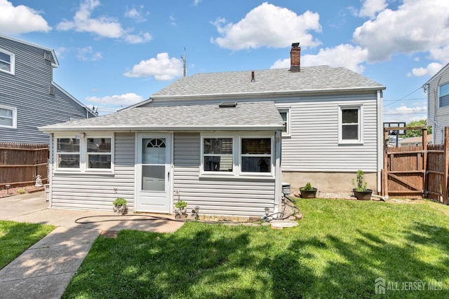 164 Holly St, Port Reading, NJ 07064 - rear view of property featuring a chimney and a shingled roof