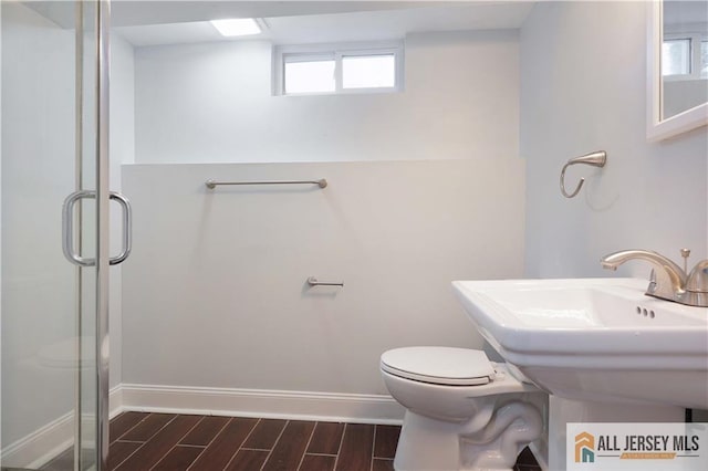 416 Wallace St Unit 416, Edison, NJ 08817 - bathroom with toilet, wood tiled floors, a stall shower, and baseboards