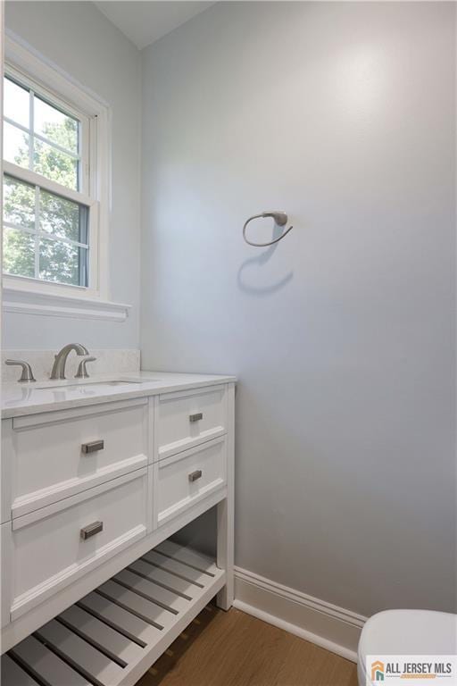 416 Wallace St Unit 416, Edison, NJ 08817 - bathroom featuring wood finished floors, vanity, toilet, and baseboards