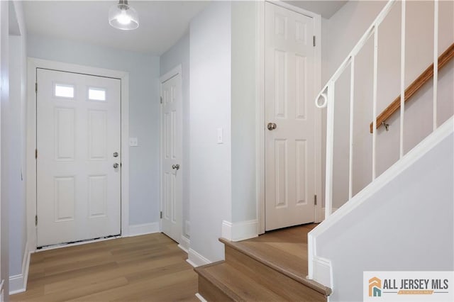416 Wallace St Unit 416, Edison, NJ 08817 - foyer with stairway, wood finished floors, and baseboards