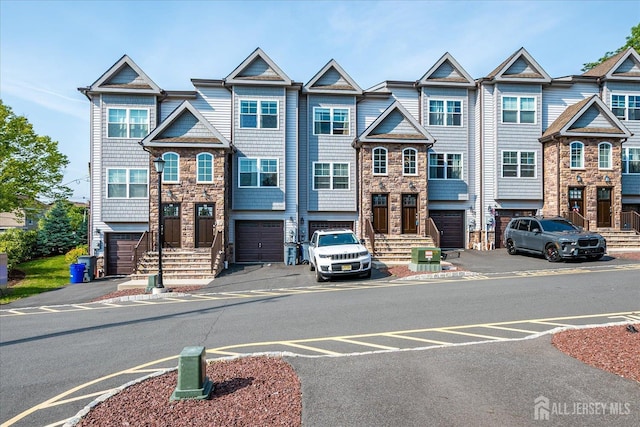240 Main St, South Amboy, NJ 08879 - multi unit property with stone siding and a garage