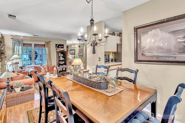 20 Sagamore Ave, Edison, NJ 08820 - dining room with a chandelier and wood finished floors