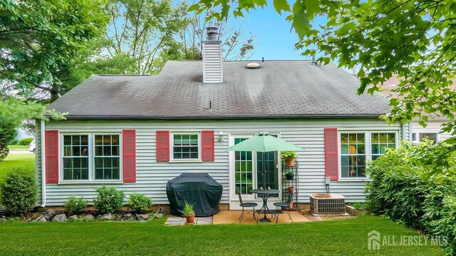 20 Sagamore Ave, Edison, NJ 08820 - back of house with a patio area, a yard, and a chimney