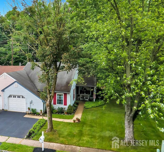 20 Sagamore Ave, Edison, NJ 08820 - view of front of property featuring an attached garage, a front lawn, and asphalt driveway