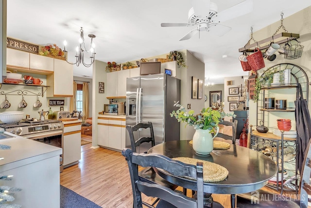 20 Sagamore Ave, Edison, NJ 08820 - dining space featuring a ceiling fan, a chandelier, and light wood-type flooring