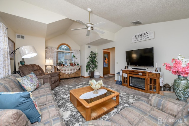 1617 Sweetbay Dr, Toms River, NJ 08755 - living area featuring a ceiling fan, wood finished floors, vaulted ceiling, and a textured ceiling