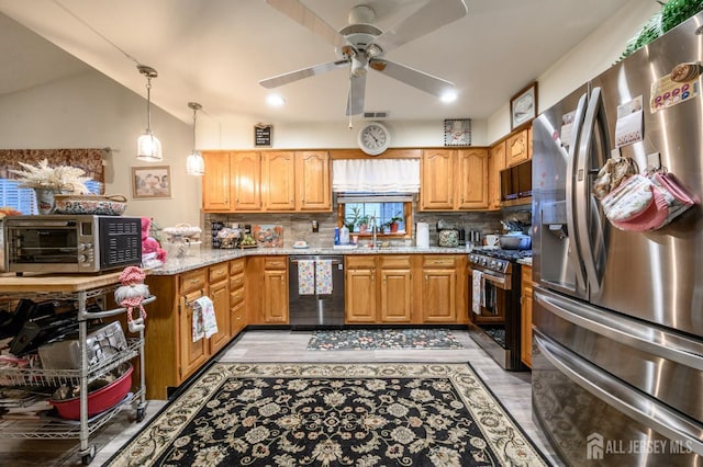 1617 Sweetbay Dr, Toms River, NJ 08755 - kitchen with stainless steel appliances, ceiling fan, light stone counters, decorative backsplash, and pendant lighting