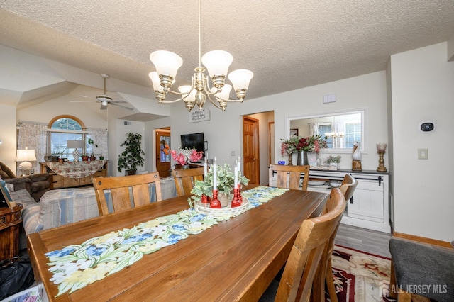 1617 Sweetbay Dr, Toms River, NJ 08755 - dining space with a ceiling fan, a chandelier, a textured ceiling, vaulted ceiling, and wood finished floors