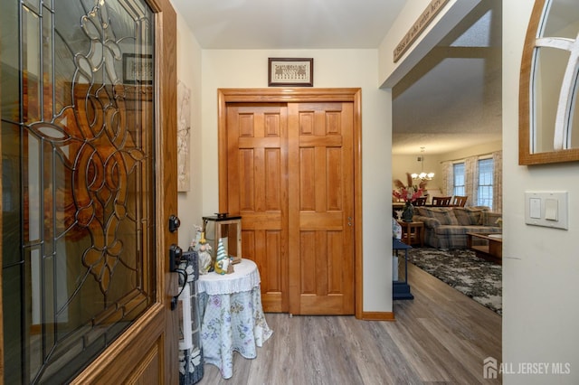1617 Sweetbay Dr, Toms River, NJ 08755 - entrance foyer featuring wood finished floors and a chandelier