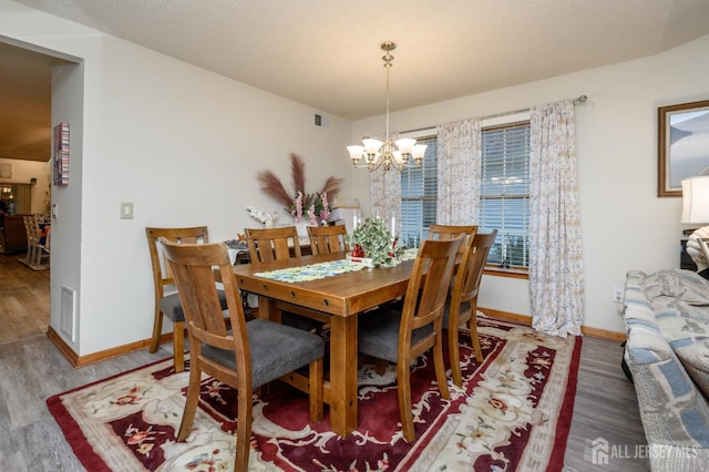1617 Sweetbay Dr, Toms River, NJ 08755 - dining area featuring a chandelier and wood finished floors