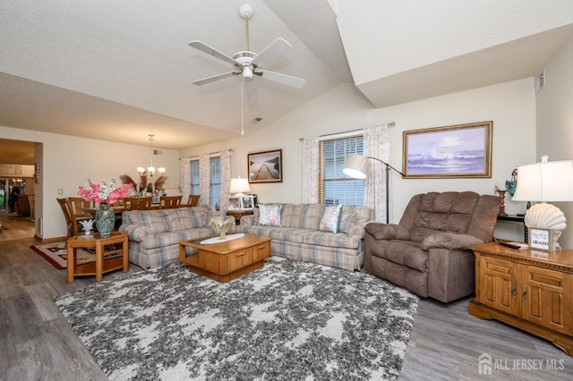 1617 Sweetbay Dr, Toms River, NJ 08755 - living room featuring wood finished floors, lofted ceiling, ceiling fan, and a chandelier