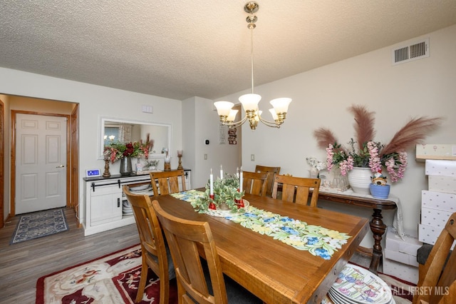 1617 Sweetbay Dr, Toms River, NJ 08755 - dining space with a chandelier, dark wood-style flooring, and a textured ceiling