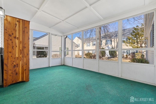 unfurnished sunroom featuring coffered ceiling and a wealth of natural light