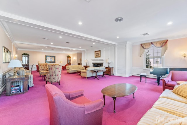 carpeted living room featuring recessed lighting, visible vents, crown molding, and a fireplace