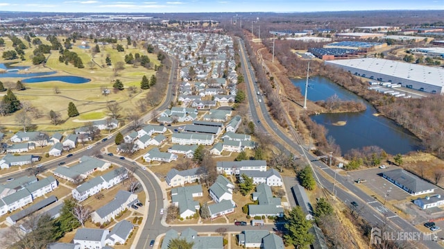 drone / aerial view with a water view and a residential view