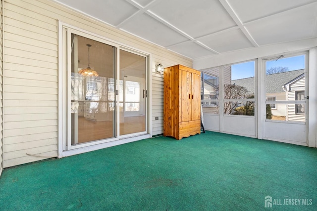 unfurnished sunroom with coffered ceiling