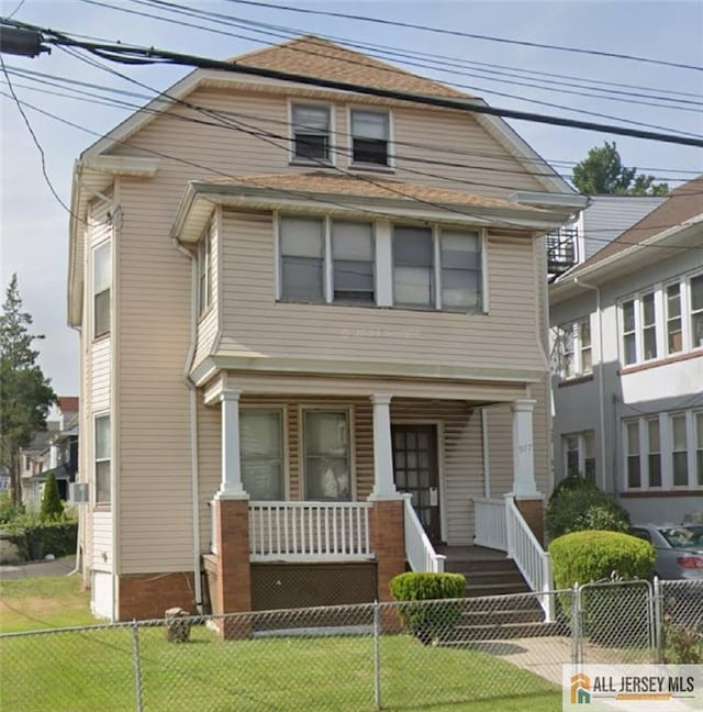 977 Sanford Ave, Irvington, NJ 07111 - american foursquare style home with covered porch and a fenced front yard