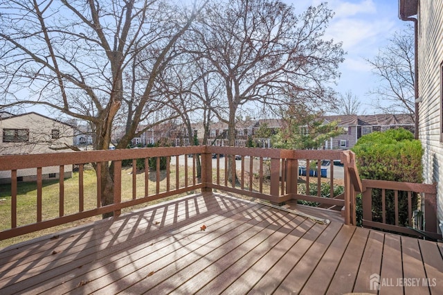 wooden deck with a residential view