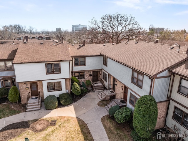 8 Highview Dr, Woodbridge Proper, NJ 07095 - view of front of house with brick siding and a shingled roof