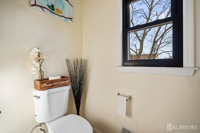 half bath featuring toilet