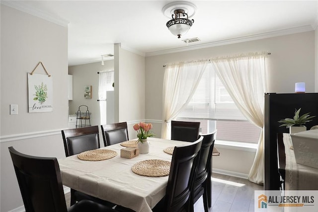 516 Great Beds Ct, Perth Amboy, NJ 08861 - dining space featuring crown molding and wood finished floors