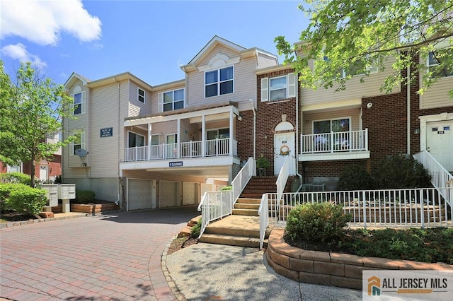 516 Great Beds Ct, Perth Amboy, NJ 08861 - view of property with an attached garage, driveway, and brick siding
