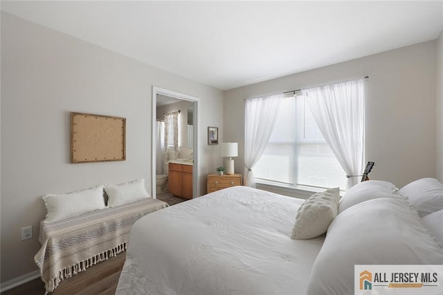 516 Great Beds Ct, Perth Amboy, NJ 08861 - bedroom featuring wood finished floors, ensuite bathroom, and baseboards