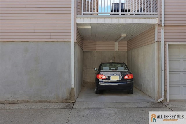 516 Great Beds Ct, Perth Amboy, NJ 08861 - view of vehicle parking featuring an attached carport