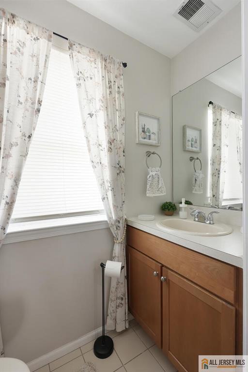 516 Great Beds Ct, Perth Amboy, NJ 08861 - bathroom with vanity, tile patterned flooring, toilet, and baseboards
