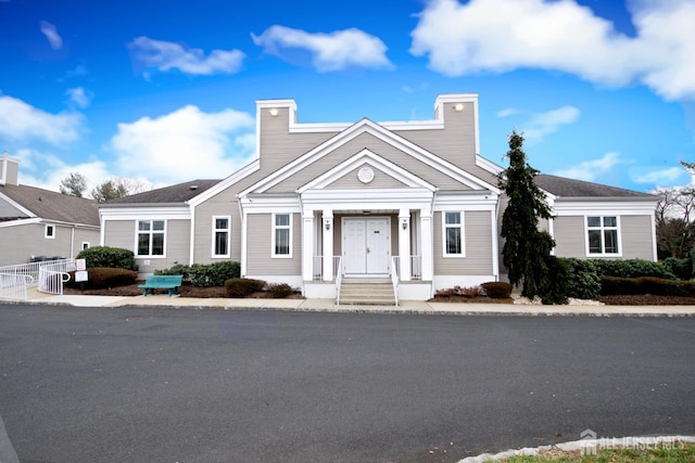 11 Wintons Way, Monroe, NJ 08831 - view of front facade with a chimney, central AC unit, and fence