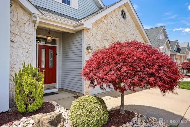 11 Wintons Way, Monroe, NJ 08831 - doorway to property featuring stone siding and roof with shingles