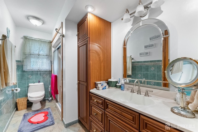 25 Turner Ave, Edison, NJ 08820 - full bath featuring a shower stall, vanity, tile walls, toilet, and tile patterned flooring