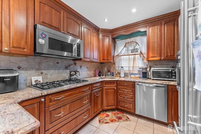25 Turner Ave, Edison, NJ 08820 - kitchen featuring appliances with stainless steel finishes, a sink, brown cabinetry, and recessed lighting